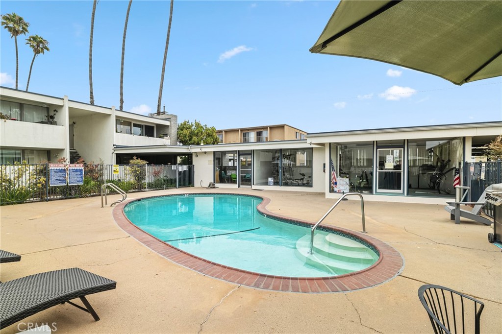 1349 Edgewood Way, Unit 49 Oxnard, CA 93030 - Photo 19 of 32 a view of a house with swimming pool