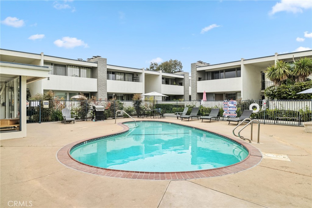1349 Edgewood Way, Unit 49 Oxnard, CA 93030 - Photo 20 of 32 a view of a swimming pool with outdoor seating
