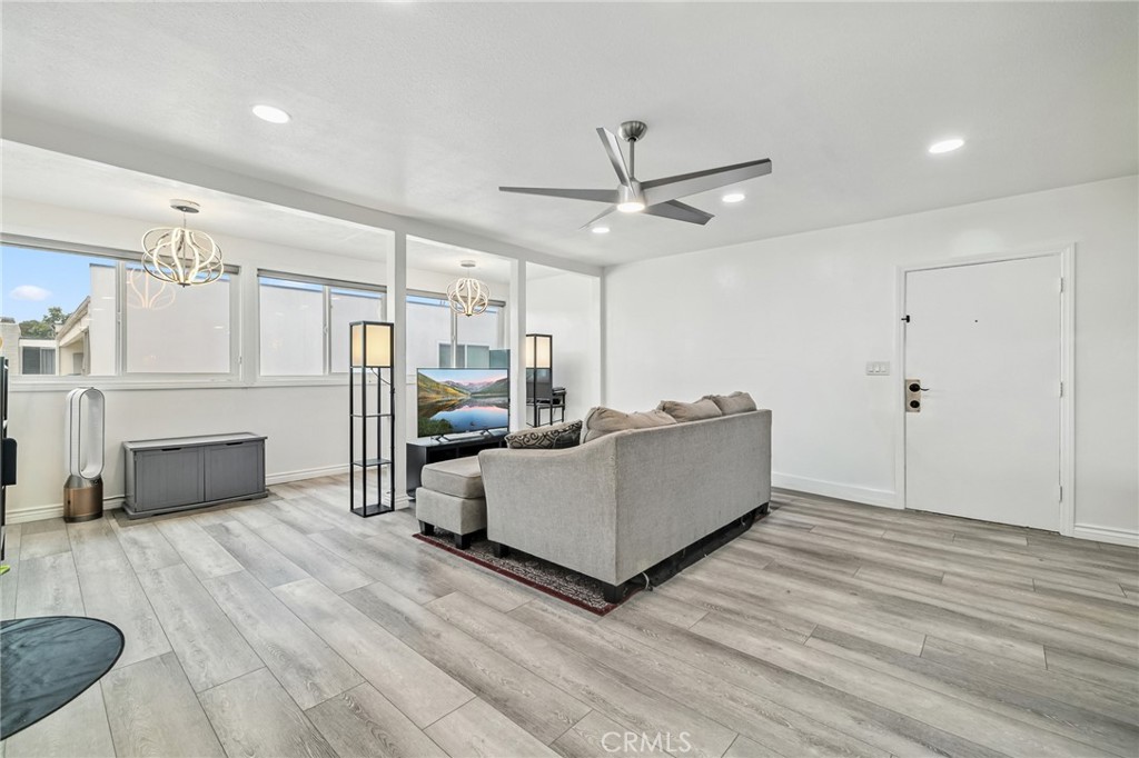 1349 Edgewood Way, Unit 49 Oxnard, CA 93030 - Photo 2 of 32 a living room with furniture and a ceiling fan