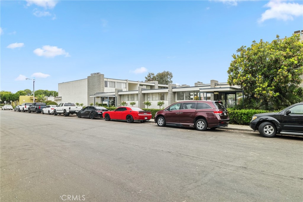 1349 Edgewood Way, Unit 49 Oxnard, CA 93030 - Photo 29 of 32 a view of a cars park in front of a building