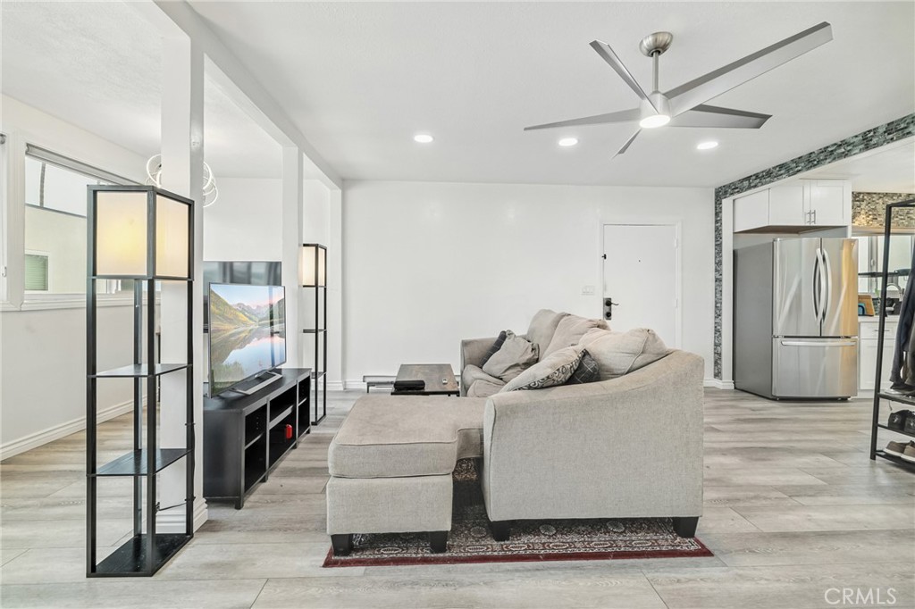 1349 Edgewood Way, Unit 49 Oxnard, CA 93030 - Photo 10 of 32 a living room with furniture and a refrigerator
