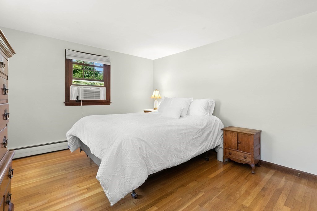 15 Silverbrook Road Topsfield, MA 01983 - Photo 12 of 42 a bedroom with a bed and a window