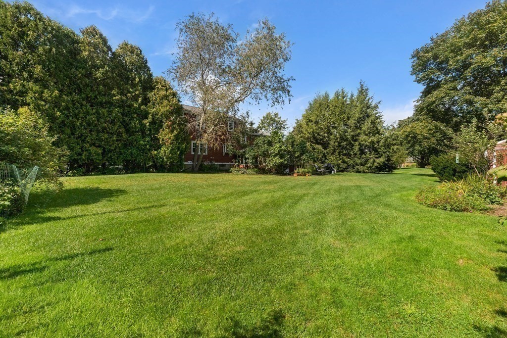 15 Silverbrook Road Topsfield, MA 01983 - Photo 31 of 42 a view of a grassy field with trees in the background