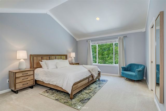 a bedroom with a bed and a couch