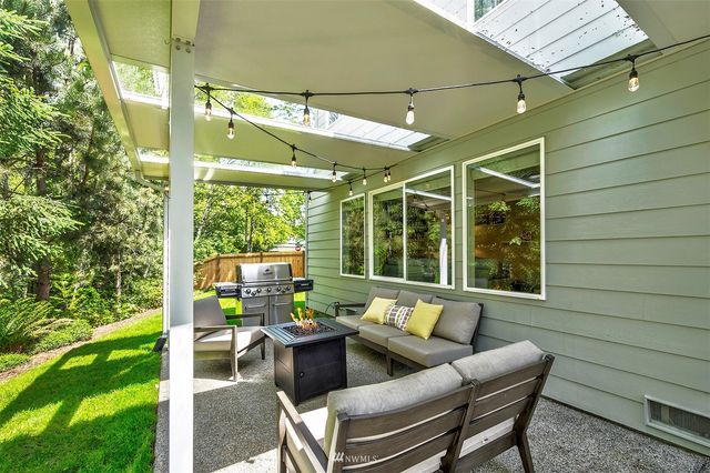 a outdoor living space with furniture and garden view
