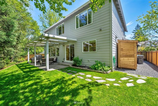 a view of a house with a yard and plants
