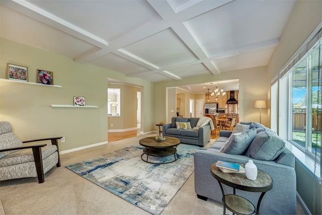 a living room with furniture and a rug