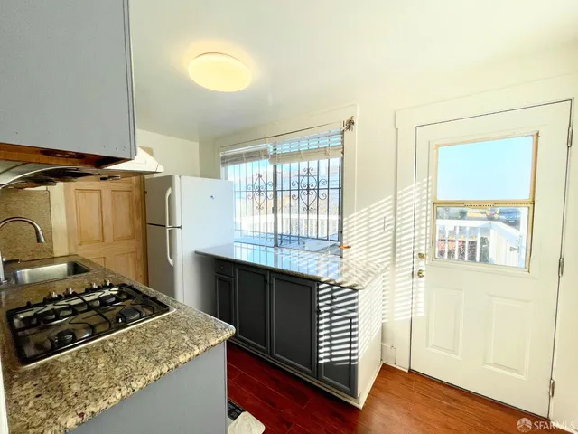 a kitchen with a stove and a cabinet