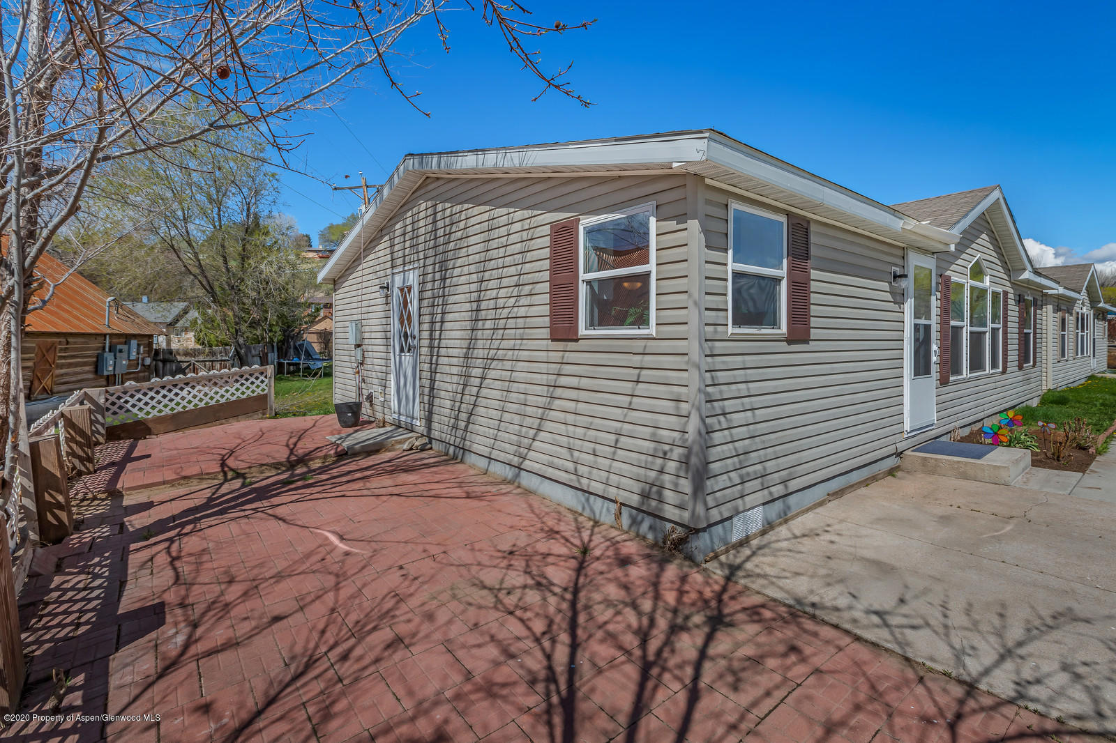 353 West 5th Street Rifle, CO 81650 - Photo 9 of 11 a front view of a house with a yard