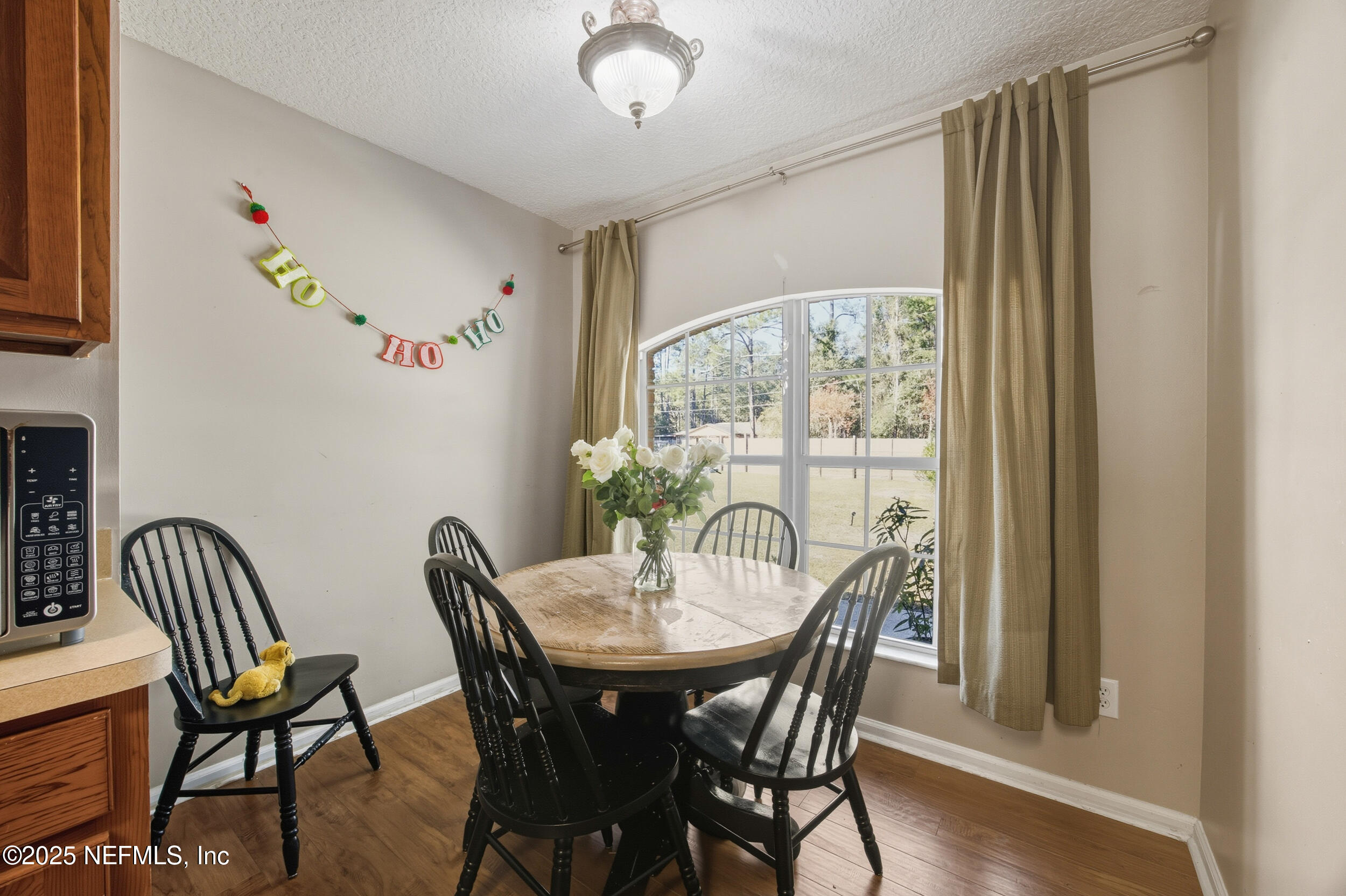 5720 Younis Road South Jacksonville, FL 32218 - Photo 18 of 34 a view of a dining room with furniture window and wooden floor