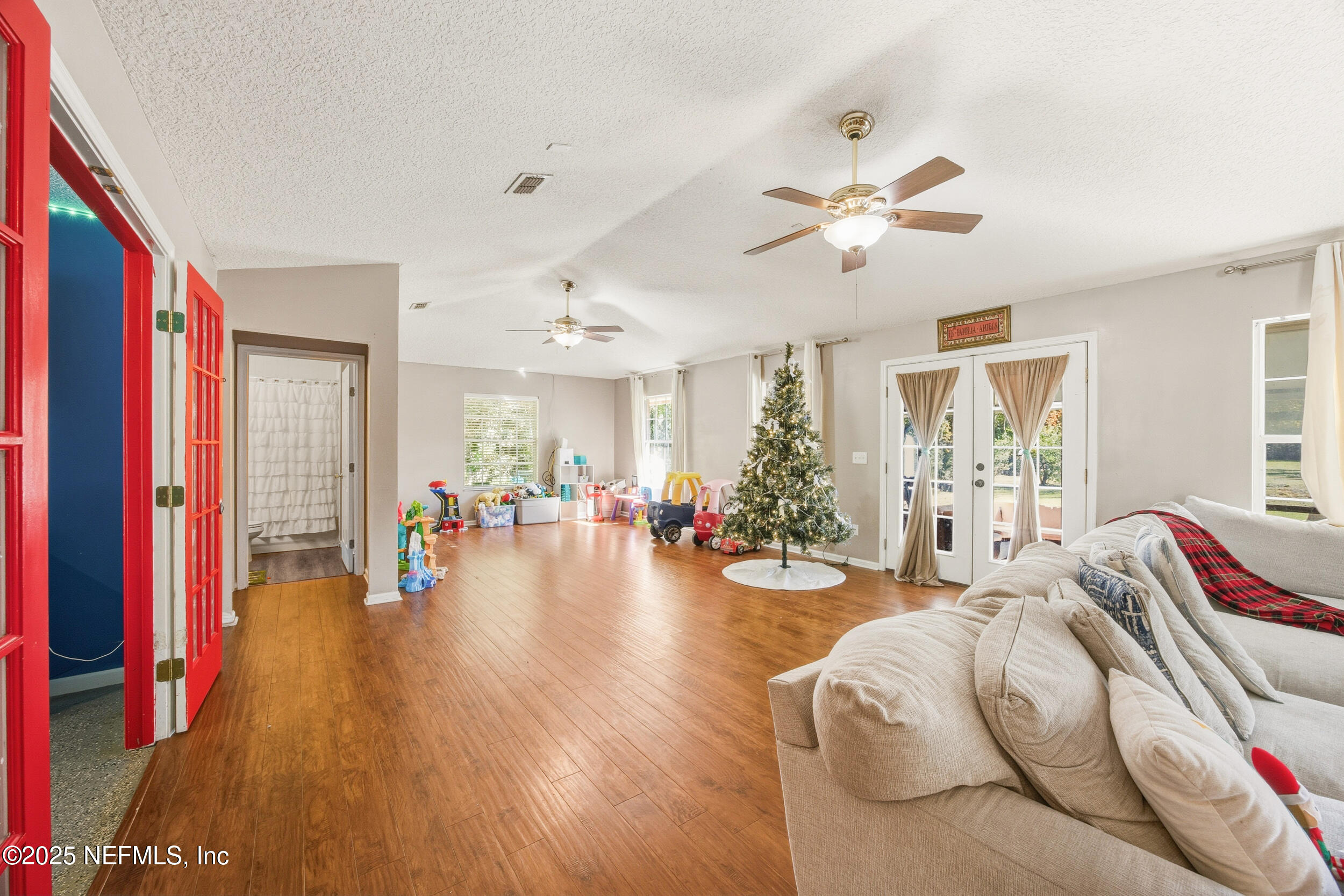 5720 Younis Road South Jacksonville, FL 32218 - Photo 23 of 34 a living room with furniture and a chandelier