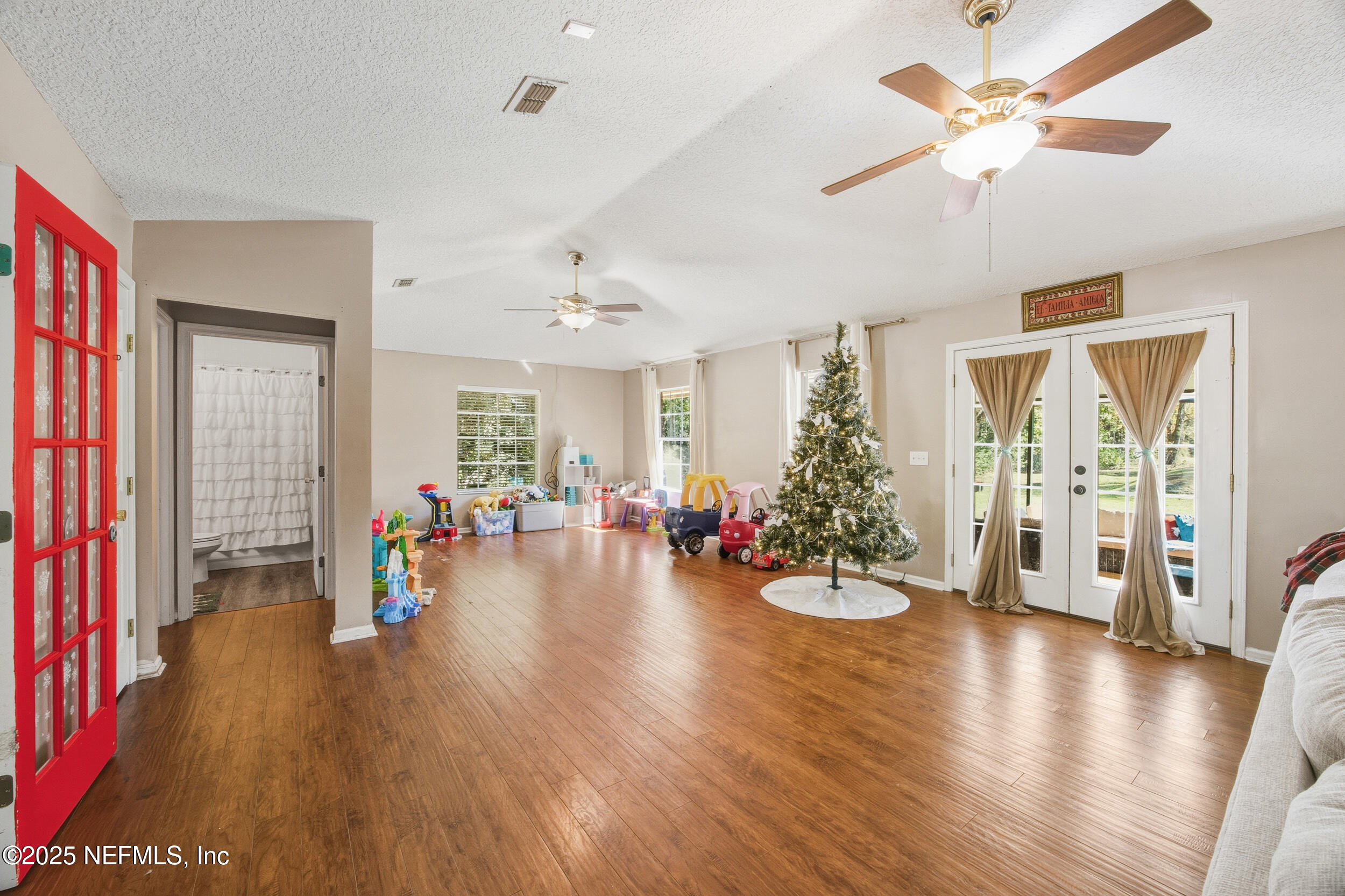 5720 Younis Road South Jacksonville, FL 32218 - Photo 24 of 34 a view of a livingroom with furniture wooden floor and a ceiling fan