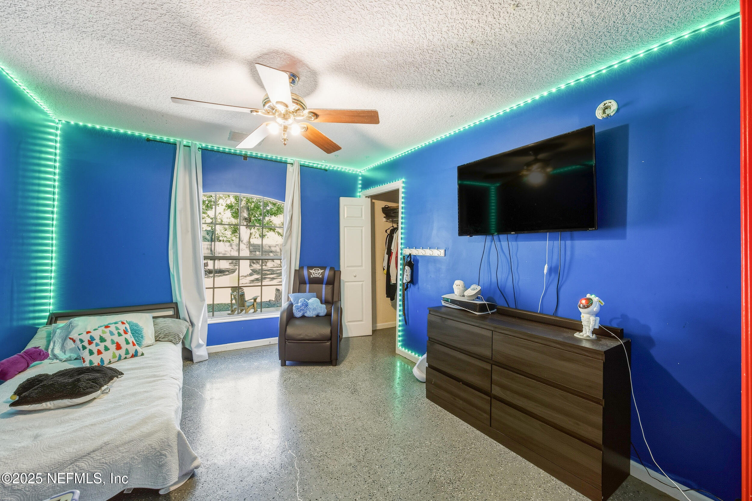 5720 Younis Road South Jacksonville, FL 32218 - Photo 28 of 34 a living room with furniture and a flat screen tv