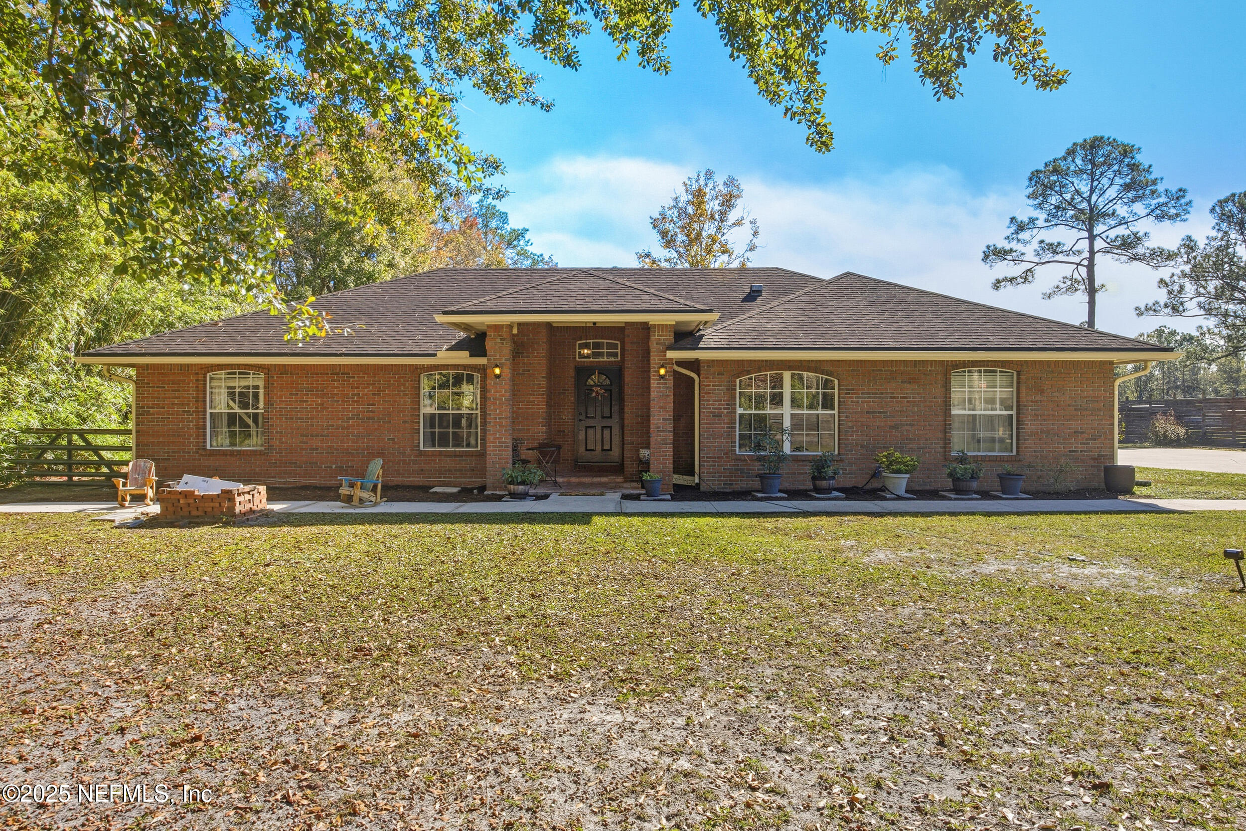 5720 Younis Road South Jacksonville, FL 32218 - Photo 3 of 34 a front view of a house with a garden