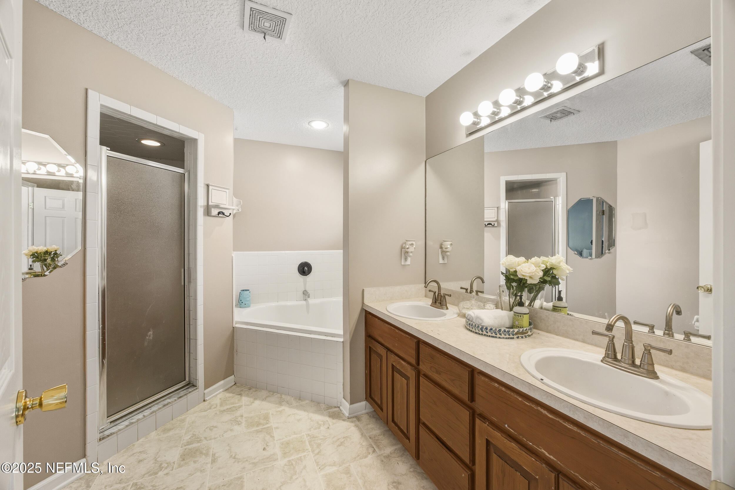 5720 Younis Road South Jacksonville, FL 32218 - Photo 33 of 34 a spacious bathroom with a bathtub shower sink double and mirror