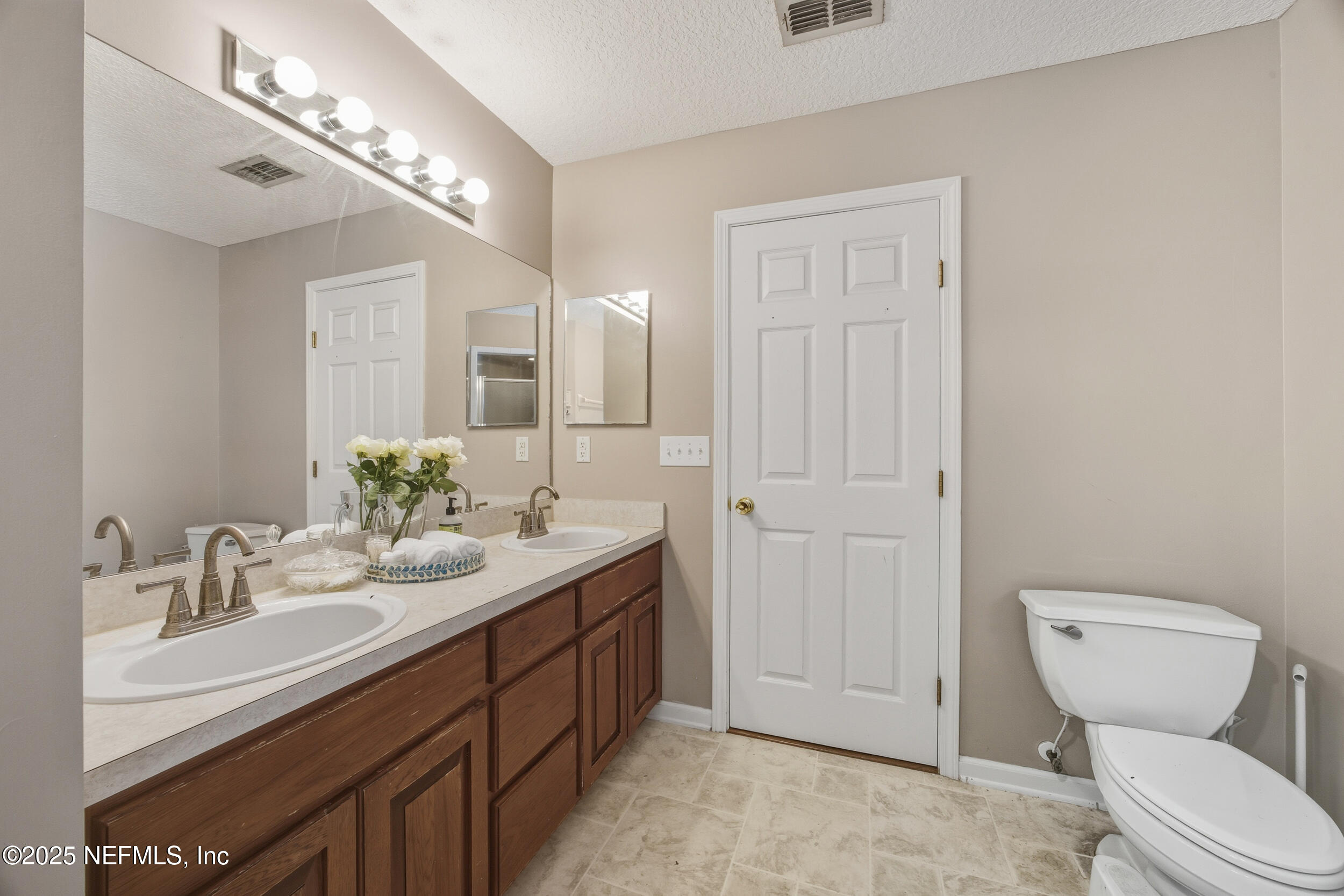 5720 Younis Road South Jacksonville, FL 32218 - Photo 34 of 34 a bathroom with a toilet sink and mirror