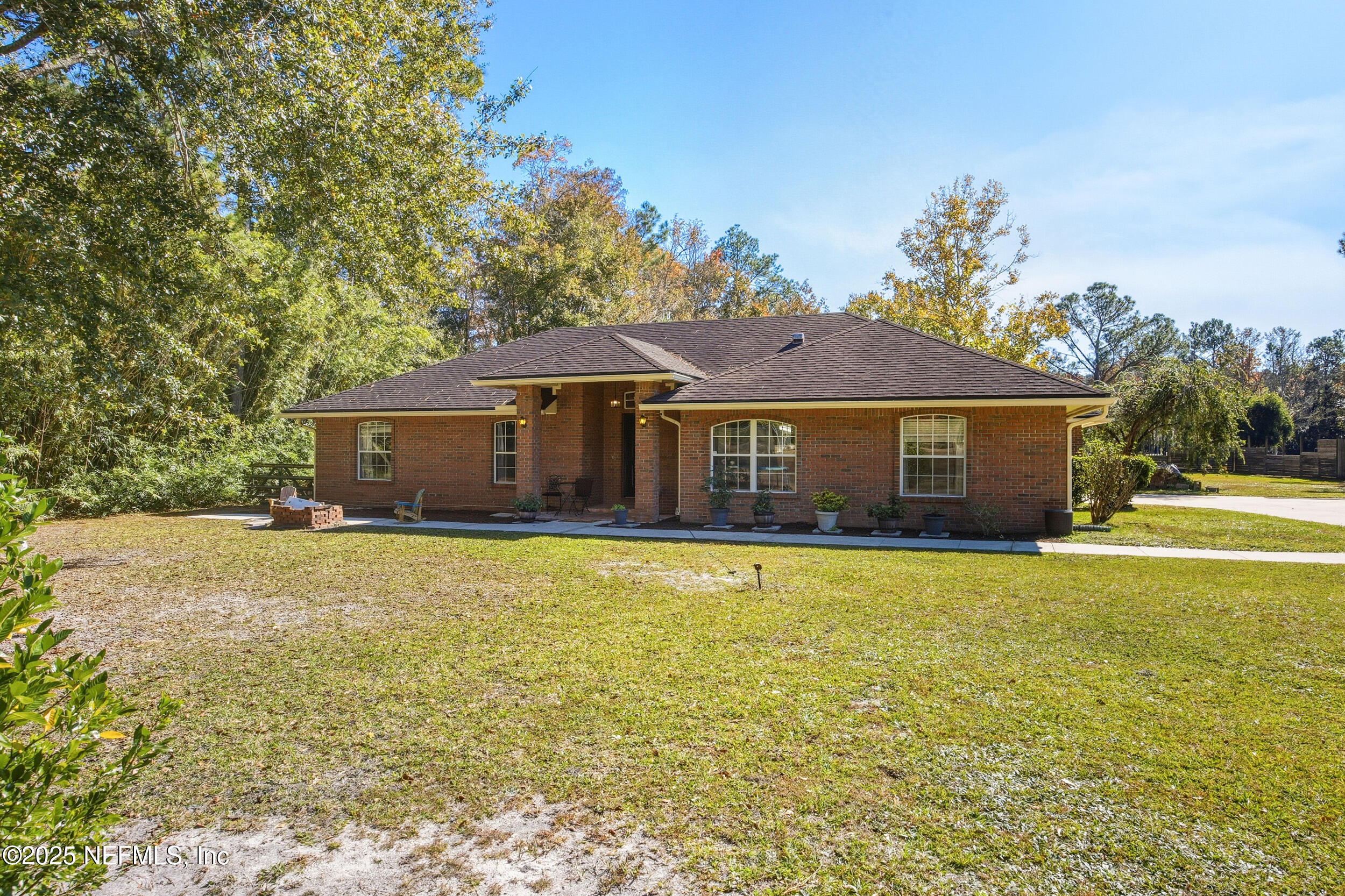 5720 Younis Road South Jacksonville, FL 32218 - Photo 4 of 34 a front view of a house with yard swimming pool and outdoor seating