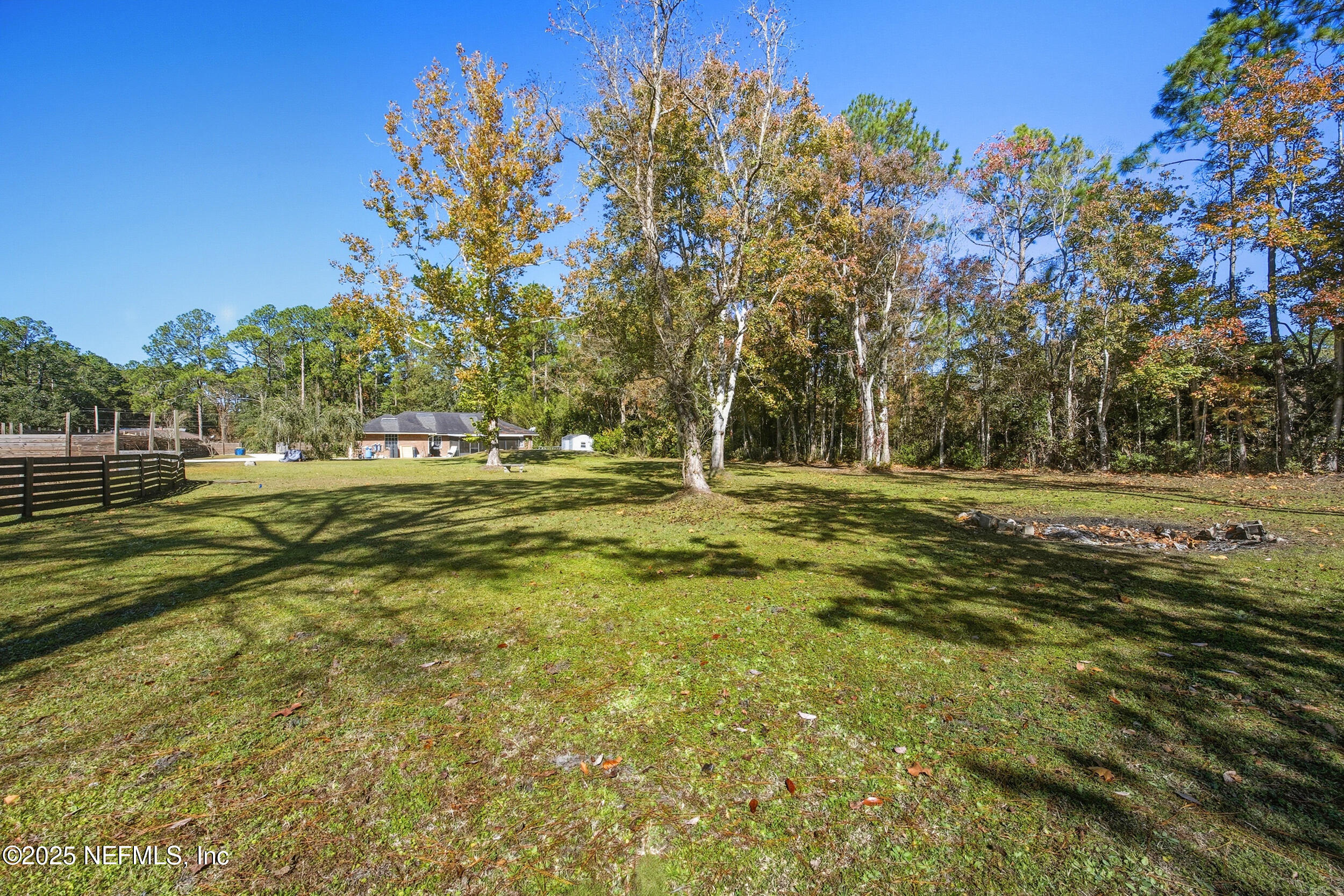 5720 Younis Road South Jacksonville, FL 32218 - Photo 10 of 34 a backyard of a house with lots of green space and outdoor space