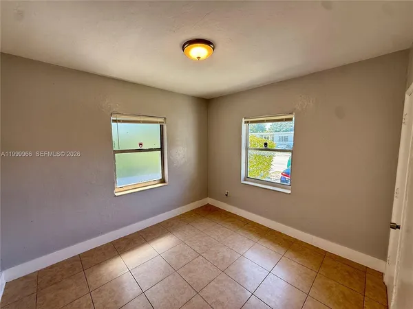 a view of an empty room and window