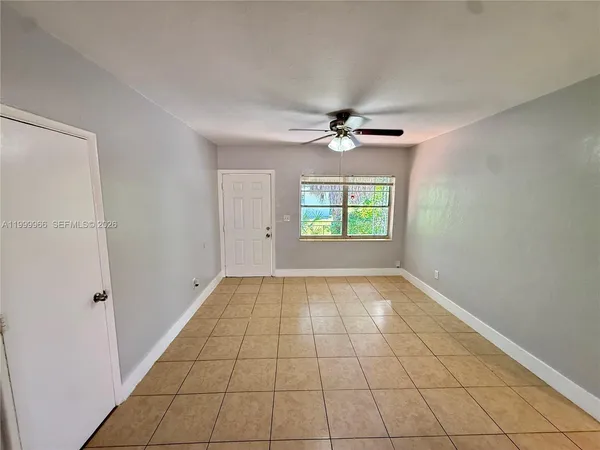 a view of an empty room with a window