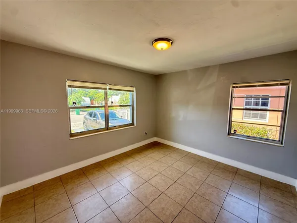 an empty room with windows