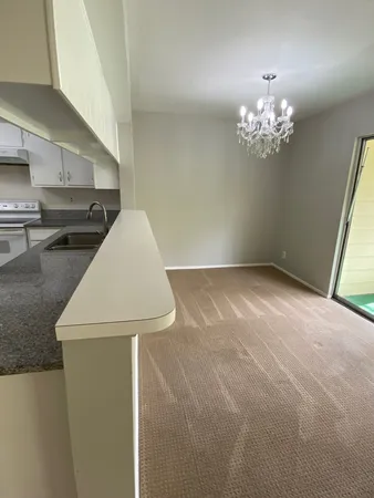 a view of kitchen and hallway