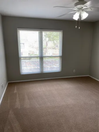 an empty room with a bathroom