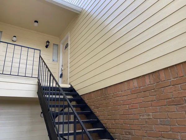 a view of entryway with wooden floor
