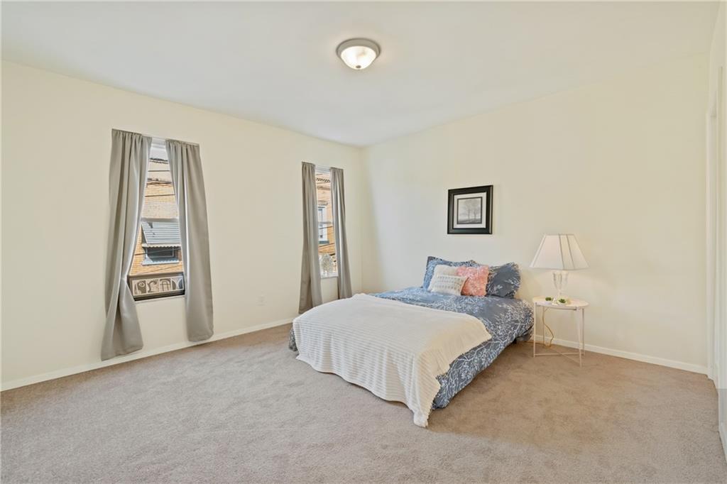 9 Edith Place Pittsburgh, PA 15213 - Photo 14 of 25 a bedroom with a bed and a cabinets