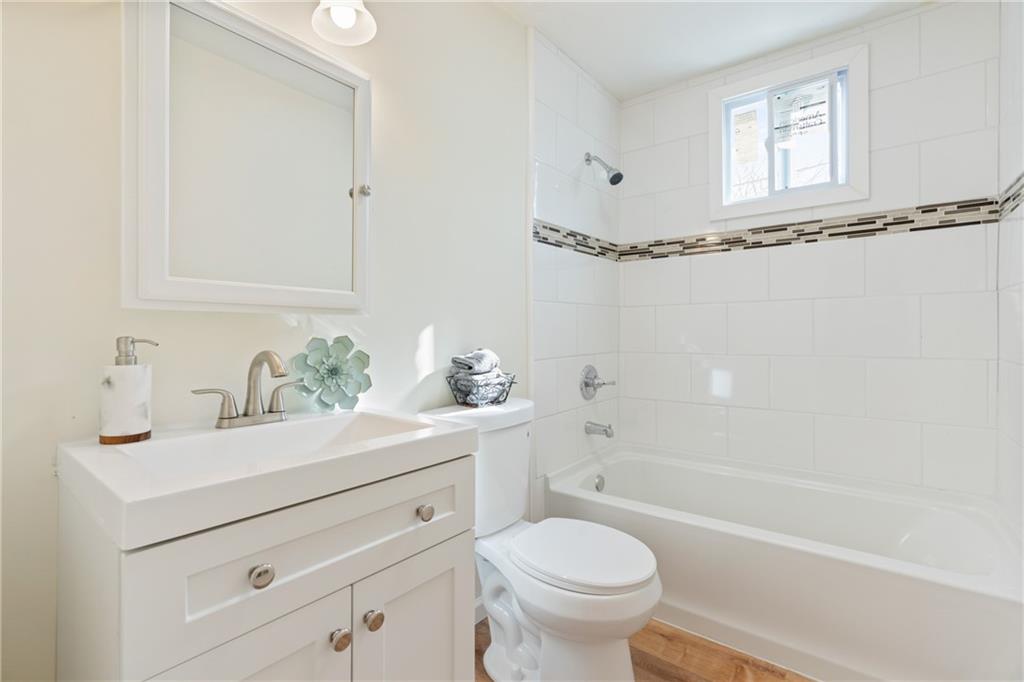 9 Edith Place Pittsburgh, PA 15213 - Photo 16 of 25 a bathroom with a sink a toilet and shower