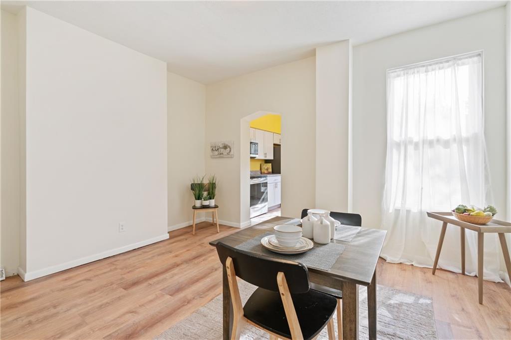 9 Edith Place Pittsburgh, PA 15213 - Photo 7 of 25 a view of a dining room with furniture and wooden floor