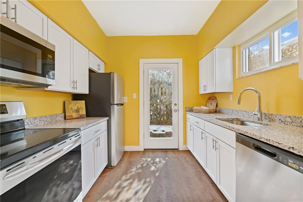 9 Edith Place Pittsburgh, PA 15213 - Photo 9 of 25 a kitchen with stainless steel appliances granite countertop a sink stove and refrigerator