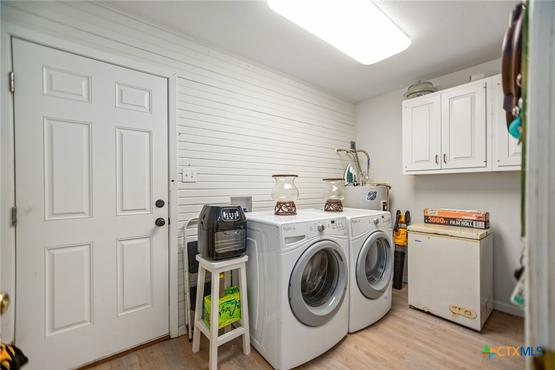 207 Williams Street Tivoli, TX 77990 - Photo 16 of 32 a utility room with dryer and washer