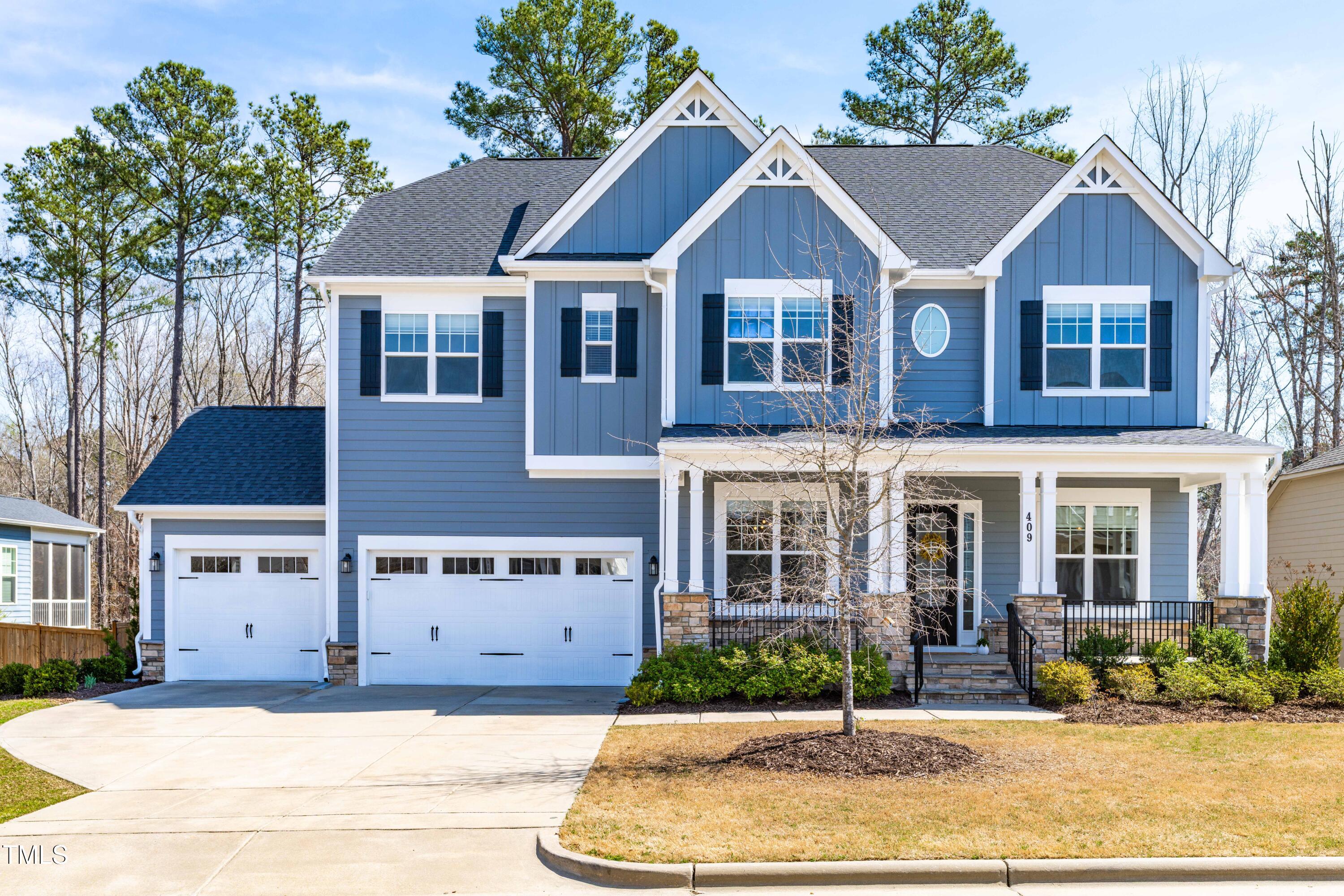 409 Tintern Lane Apex, NC 27523 - Photo 1 of 62 a front view of a house with a yard