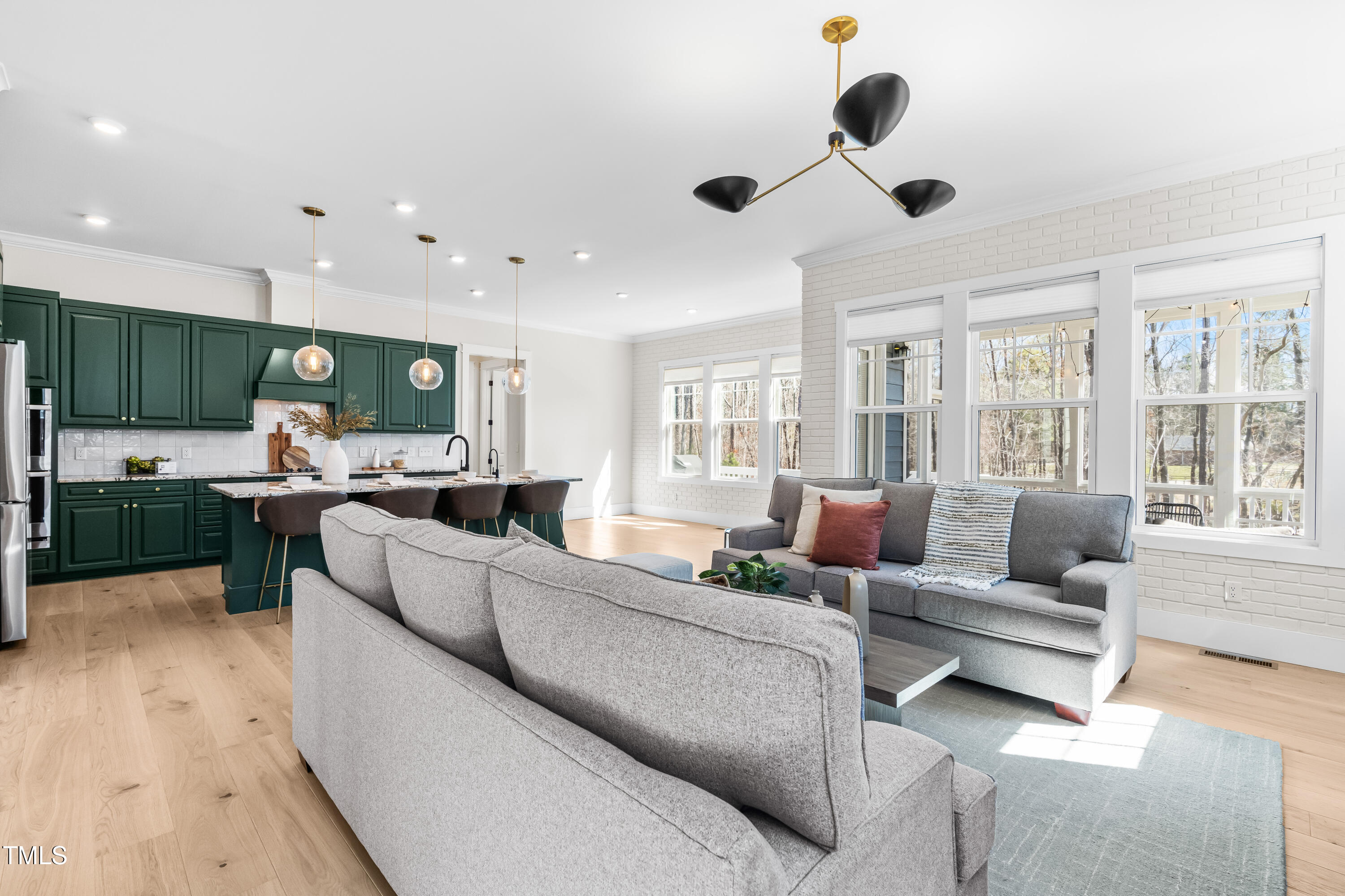 409 Tintern Lane Apex, NC 27523 - Photo 13 of 62 a living room with furniture and a large window