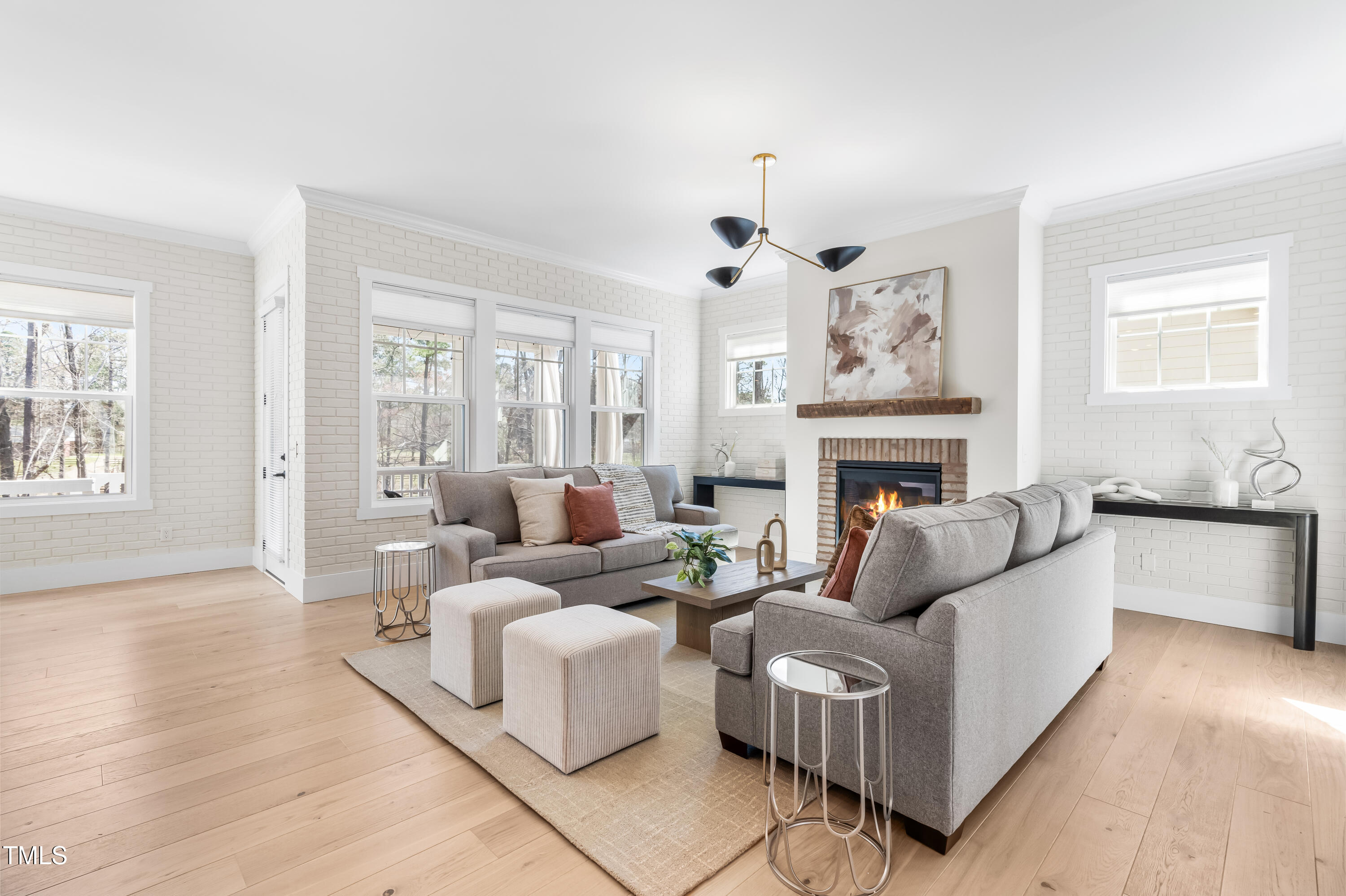 409 Tintern Lane Apex, NC 27523 - Photo 23 of 62 a living room with furniture fireplace and window