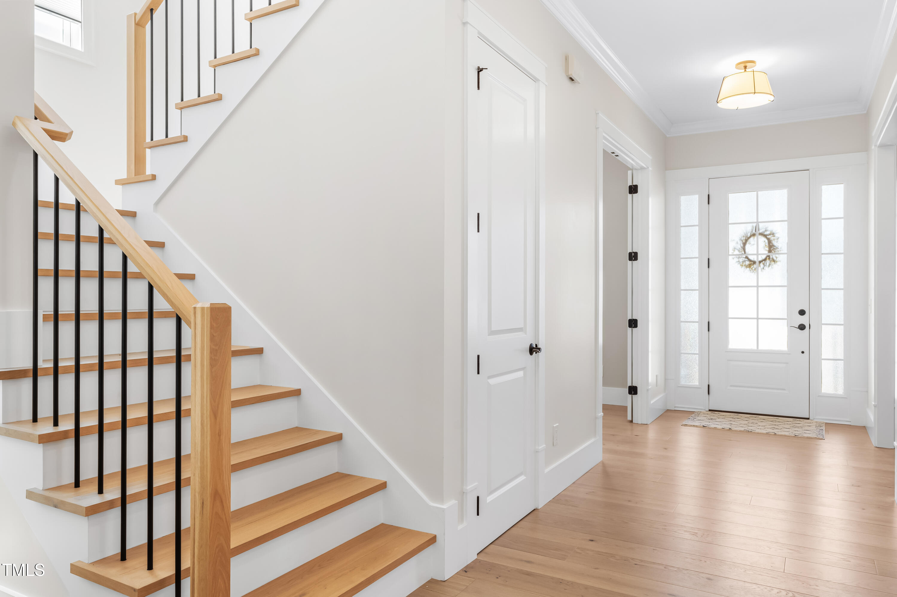 409 Tintern Lane Apex, NC 27523 - Photo 24 of 62 a view of an entryway with wooden floor