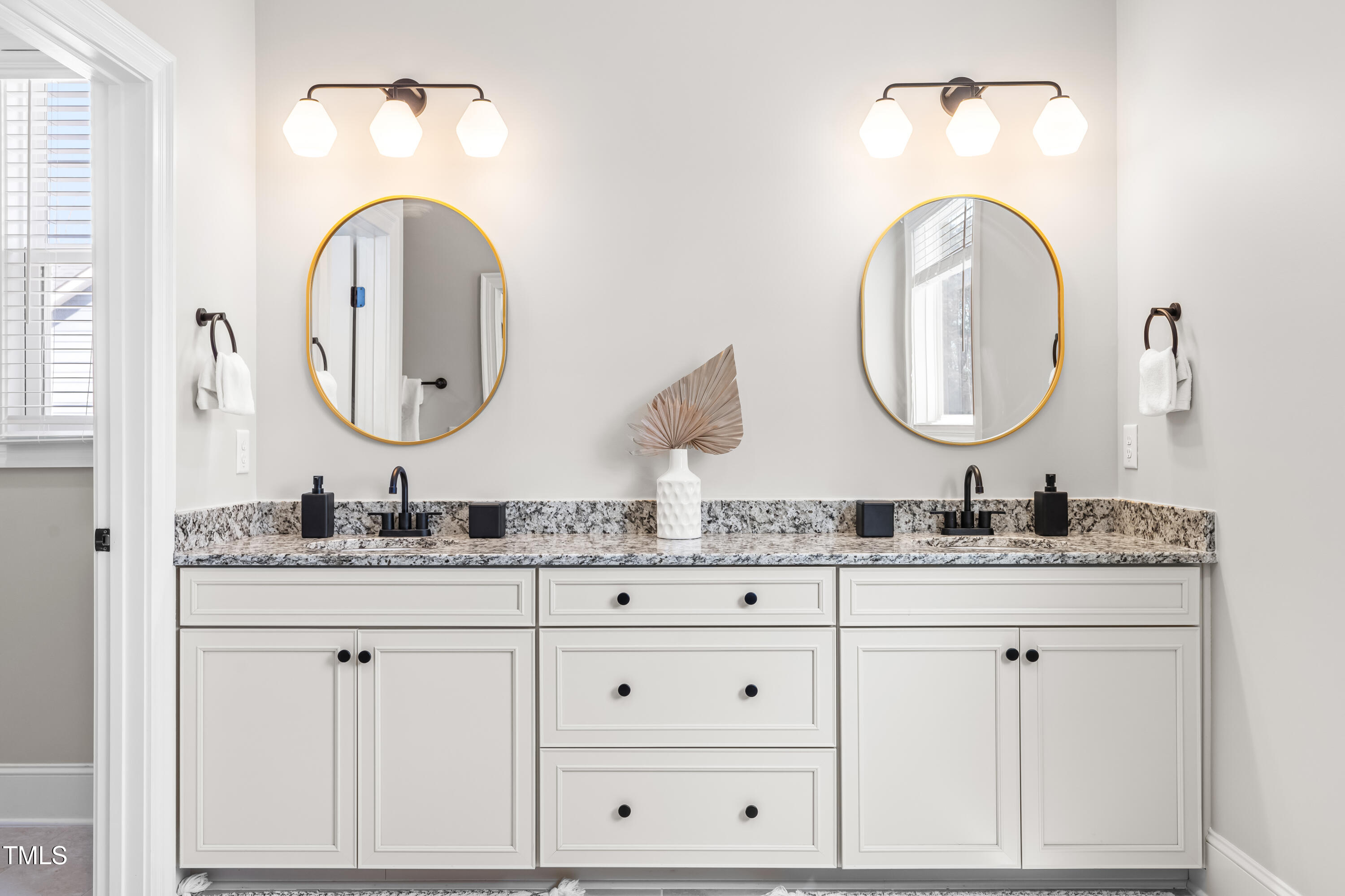 409 Tintern Lane Apex, NC 27523 - Photo 29 of 62 a bathroom with a granite countertop double vanity sink and a mirror