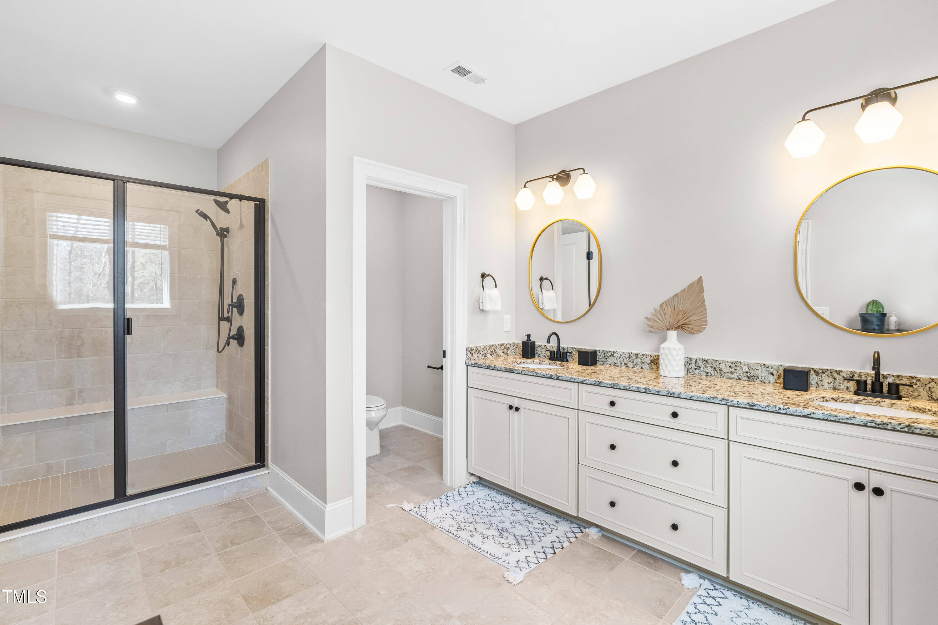 409 Tintern Lane Apex, NC 27523 - Photo 30 of 62 a room with double vanity sink and a mirror