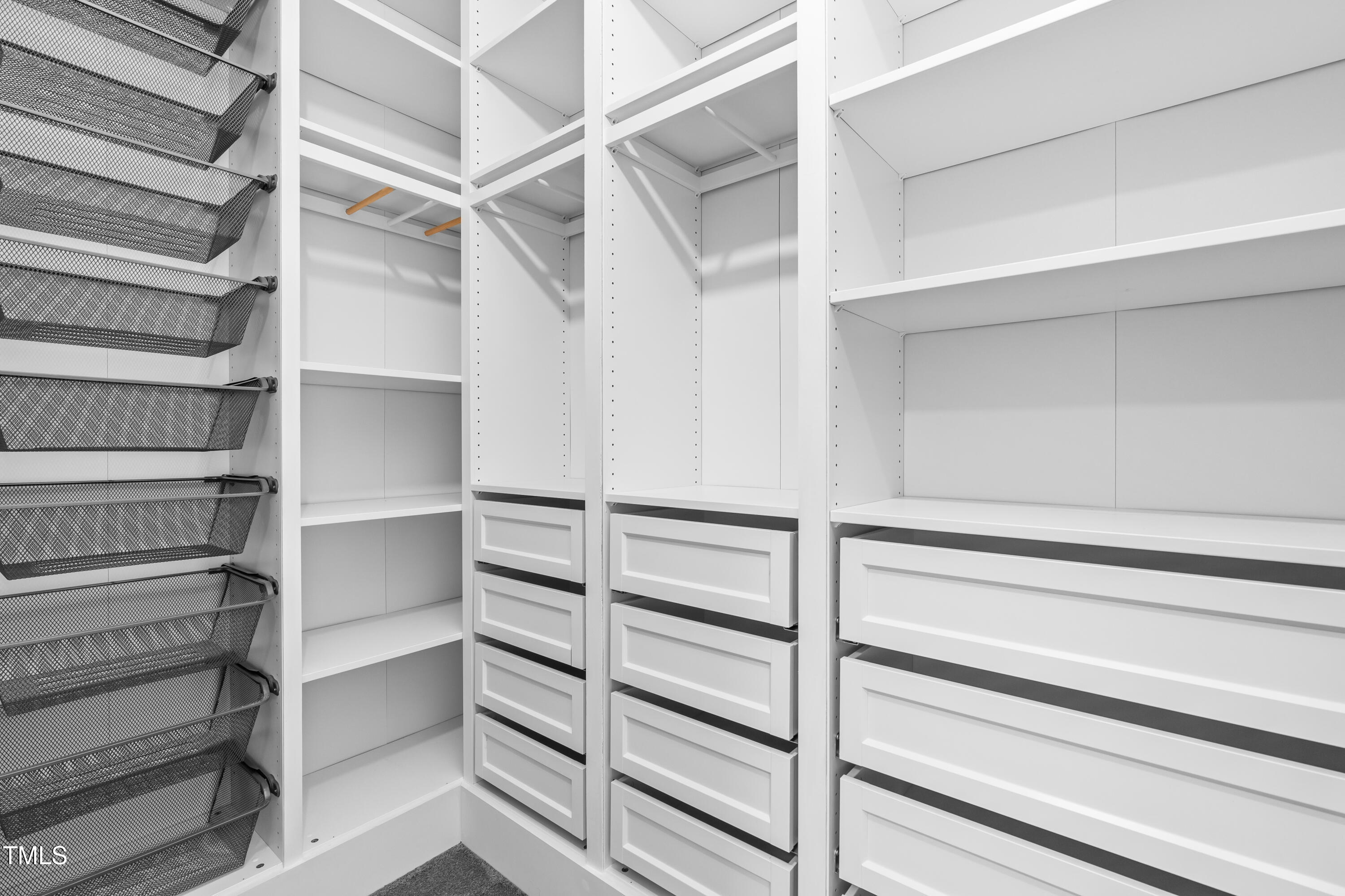 409 Tintern Lane Apex, NC 27523 - Photo 44 of 62 a view of walk in closet with empty racks