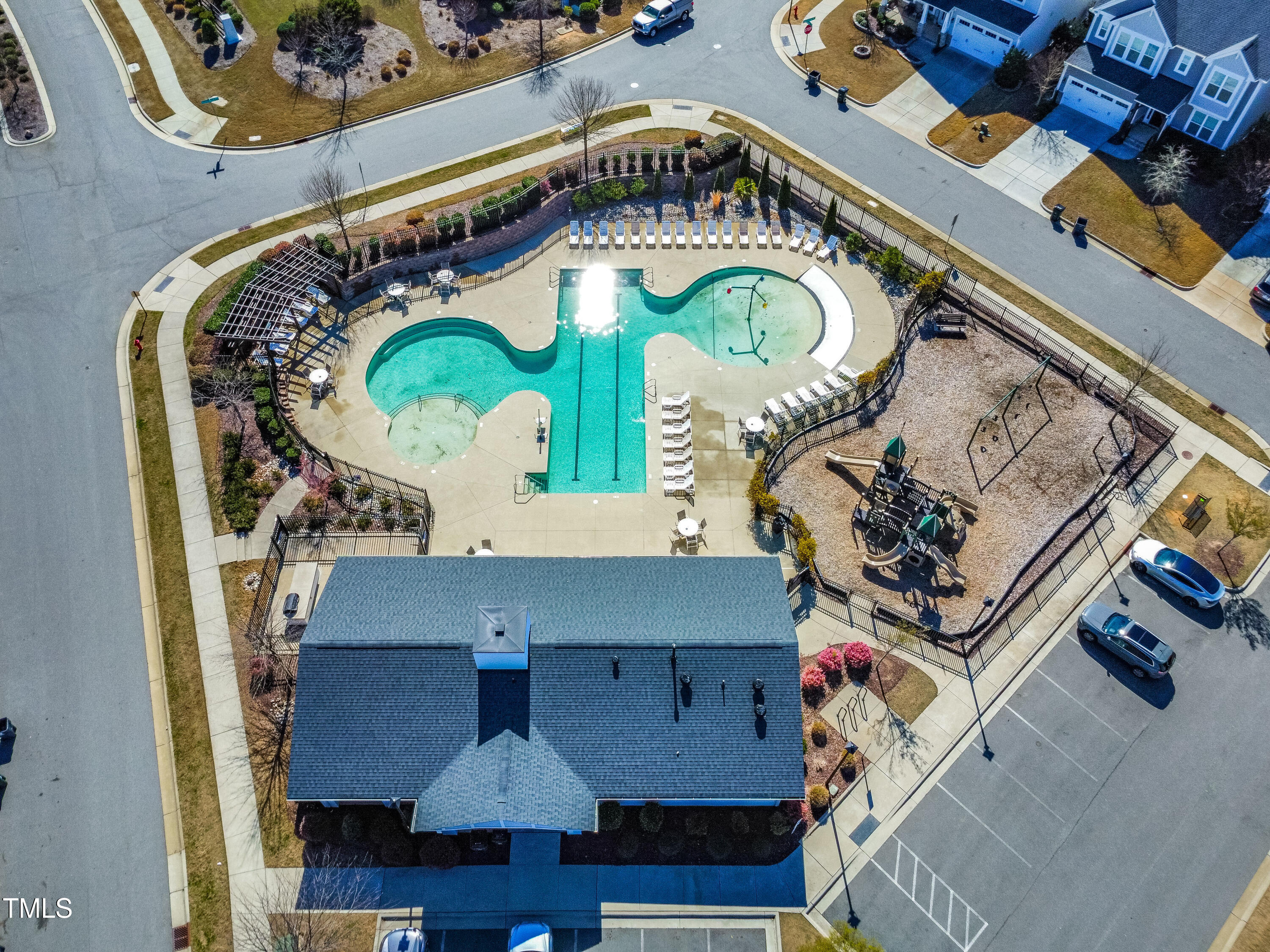 409 Tintern Lane Apex, NC 27523 - Photo 59 of 62 an aerial view of a house with a swimming pool and outdoor seating
