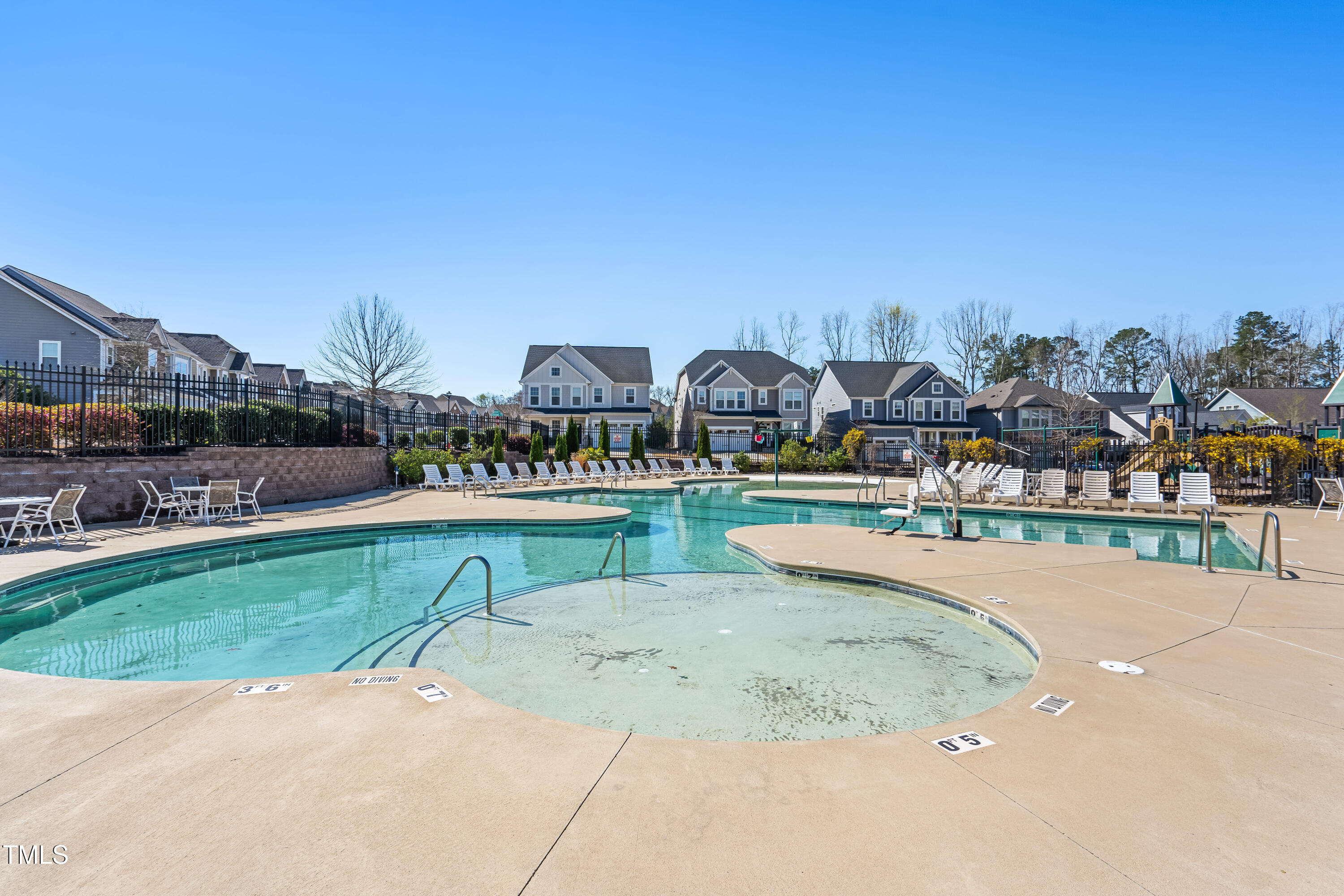 409 Tintern Lane Apex, NC 27523 - Photo 61 of 62 a view of a swimming pool and a yard