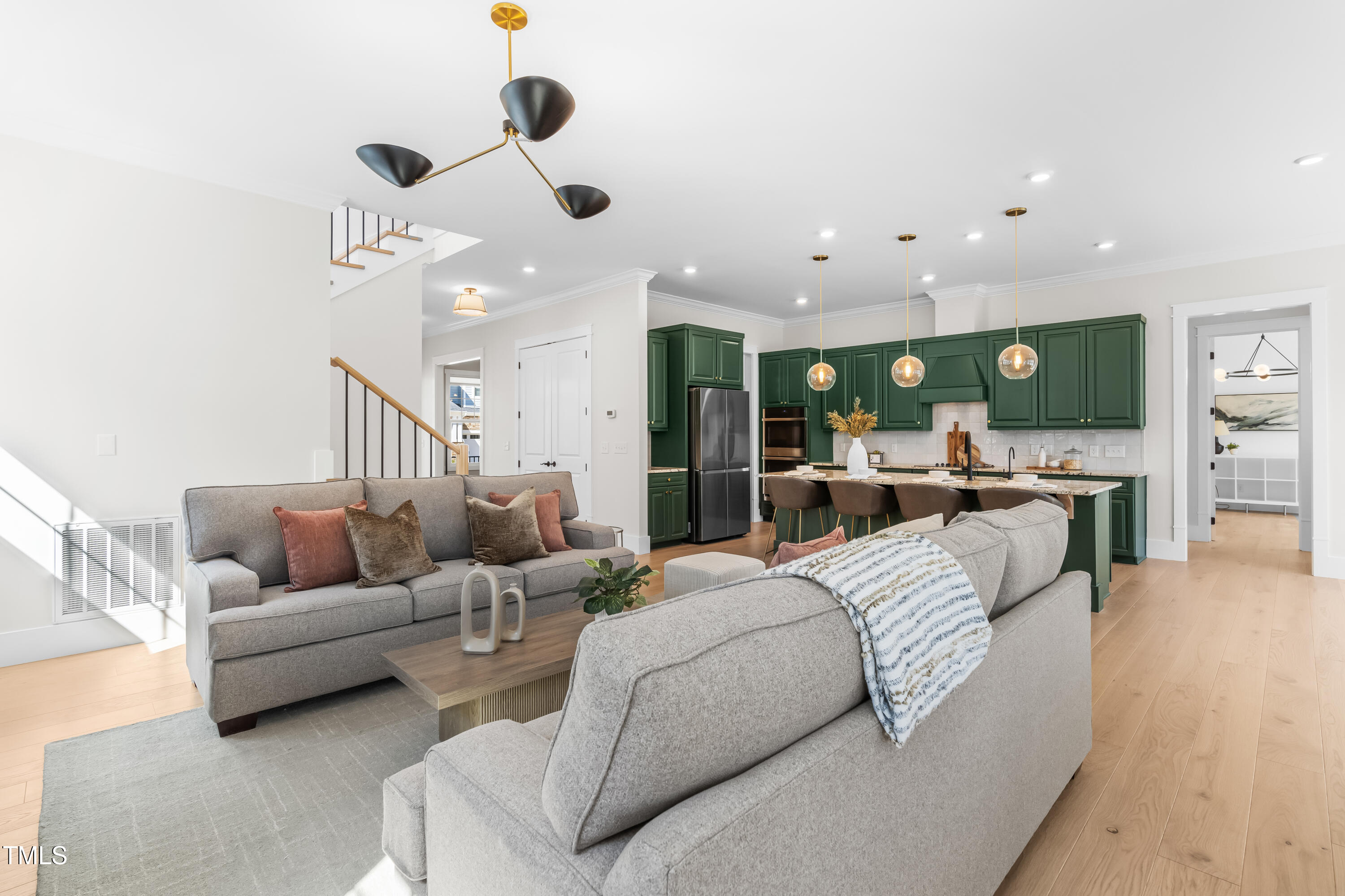 409 Tintern Lane Apex, NC 27523 - Photo 8 of 62 a living room with furniture and kitchen view