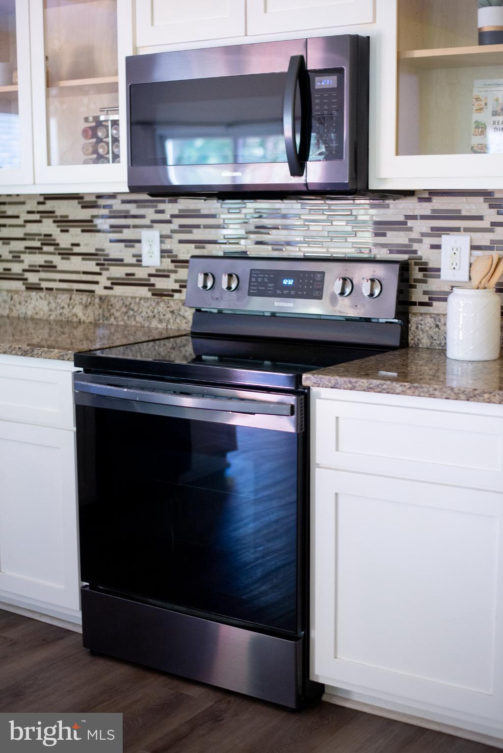 15212 Fairen Lane Colonial Heights, VA 23834 - Photo 13 of 31 a stove top oven sitting inside of a kitchen