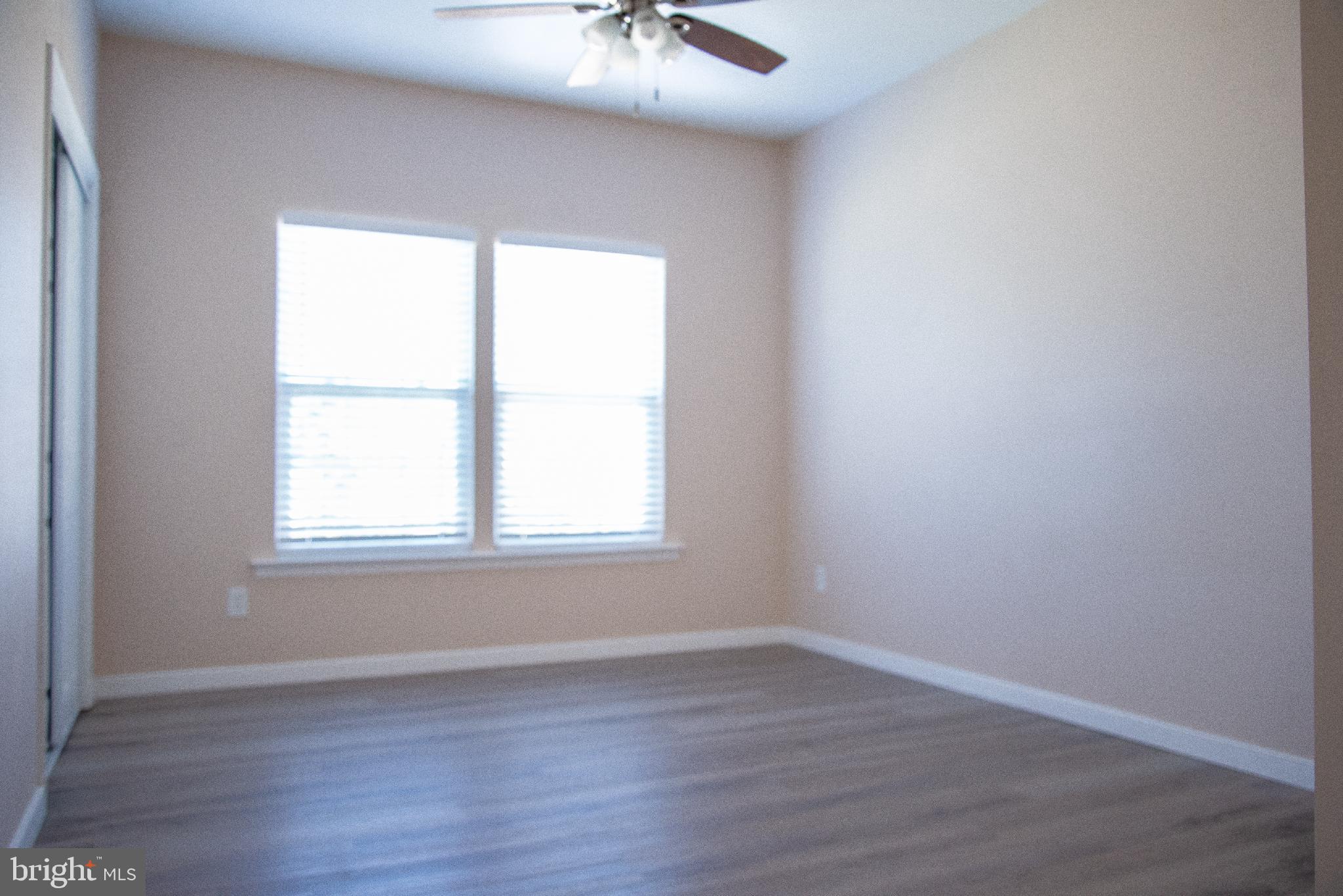 15212 Fairen Lane Colonial Heights, VA 23834 - Photo 19 of 31 an empty room with wooden floor and windows