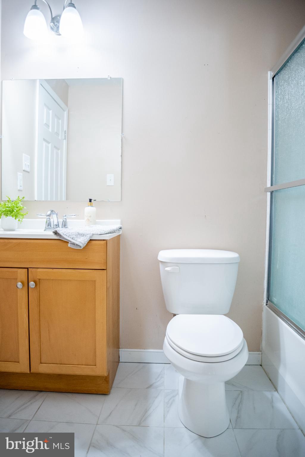 15212 Fairen Lane Colonial Heights, VA 23834 - Photo 20 of 31 a white toilet sitting next to a bathroom sink