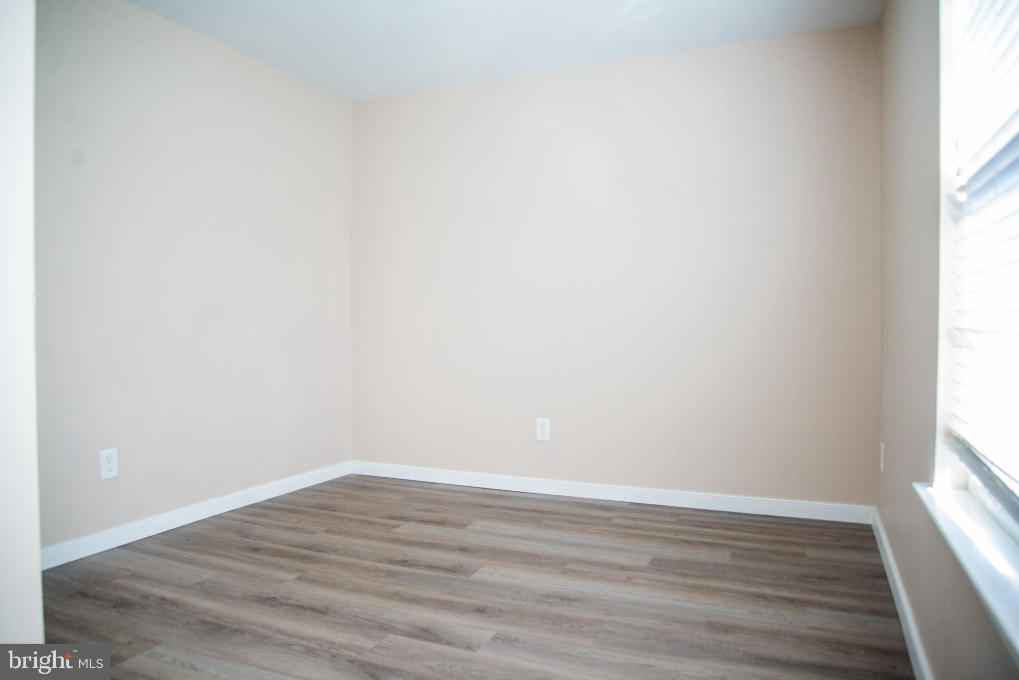 15212 Fairen Lane Colonial Heights, VA 23834 - Photo 21 of 31 a view of an empty room and wooden floor and a window