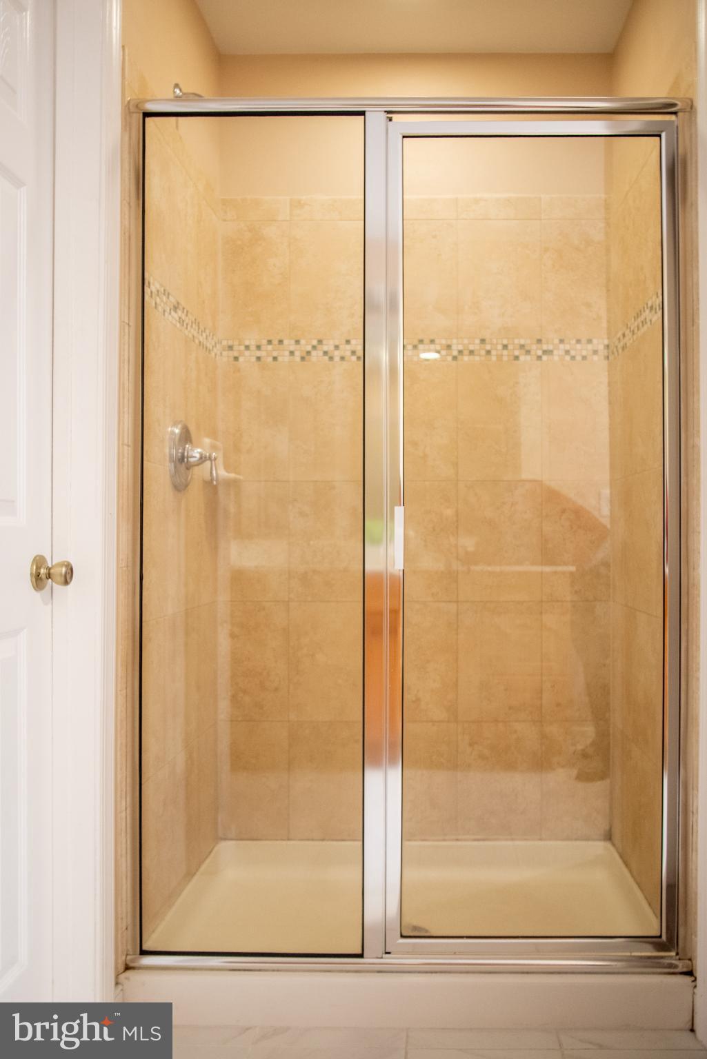 15212 Fairen Lane Colonial Heights, VA 23834 - Photo 28 of 31 a bathroom with a glass shower door