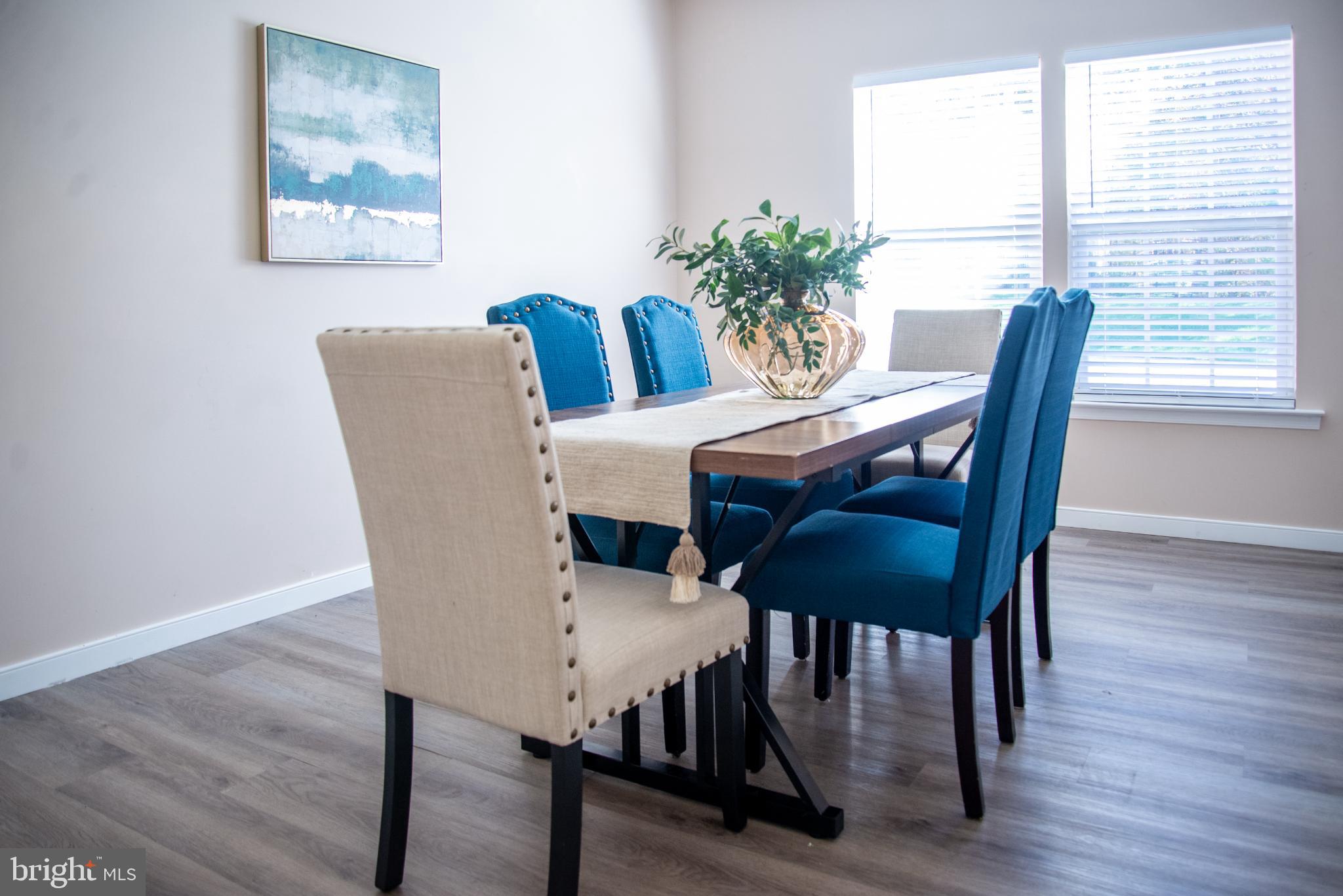 15212 Fairen Lane Colonial Heights, VA 23834 - Photo 6 of 31 a view of a dining room with furniture window and wooden floor
