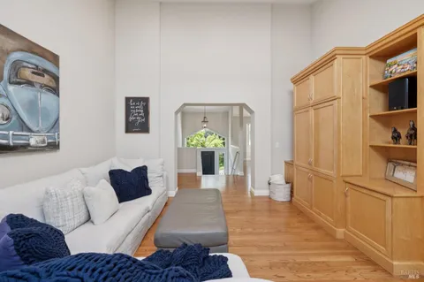 a bathroom with a double vanity sink mirror and a bathtub
